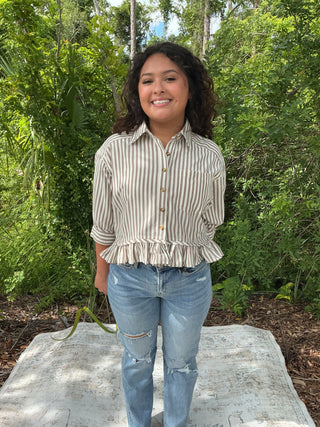 Light blue and white striped button-up top with a ruffle hem and short sleeves