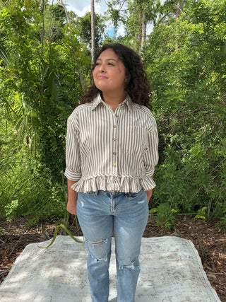 Light blue and white striped button-up top with a ruffle hem and short sleeves