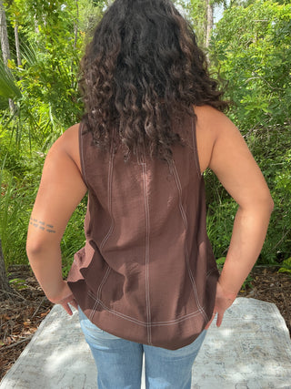 Light blue sleeveless tank top with contrast stitching, perfect for layering or casual wear