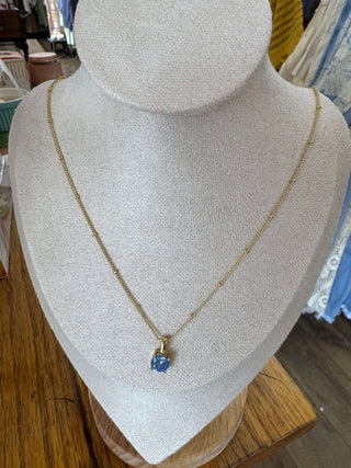 Elegant BIRTHSTONE Necklace by Lauren Kenzie with a Lifetime Warranty, showcasing a delicate pendant on a silver chain.