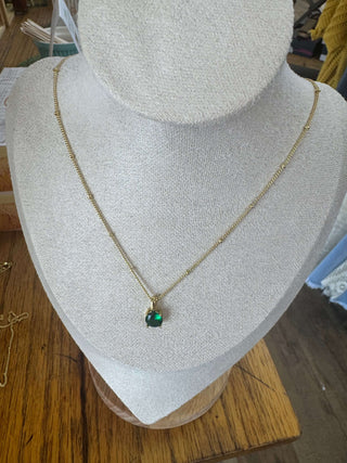 Elegant BIRTHSTONE Necklace by Lauren Kenzie with Lifetime Warranty, showcasing a sparkling gemstone pendant and delicate chain.