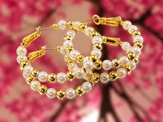 Pearl and gold bead hoop earrings with alternating white pearls and gold-plated beads on gold-tone posts.
