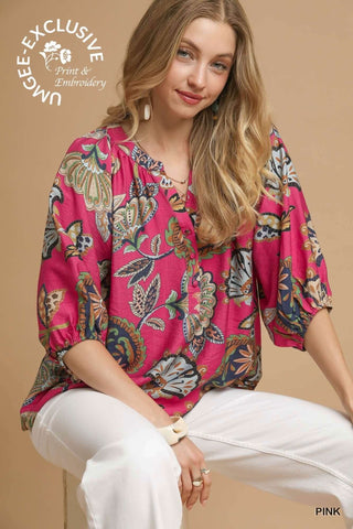 Pink & Navy Paisley Puff Sleeve Top by Umgee on hanger, showcasing vibrant paisley pattern and stylish puff sleeves.