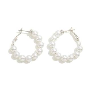 Elegant pearl beaded hoop earrings with a classic gold finish, perfect for adding a touch of sophistication to any outfit.