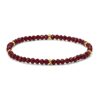 Maroon faceted beaded bracelet with gold spacer accents.
