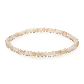 Cream and gold faceted beaded bracelet with light champagne-colored rondelle stones.
