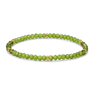 Peridot beaded bracelet with gold spacer accents and elastic band.
