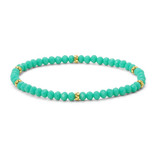 Turquoise faceted bead bracelet with gold spacer accents.
