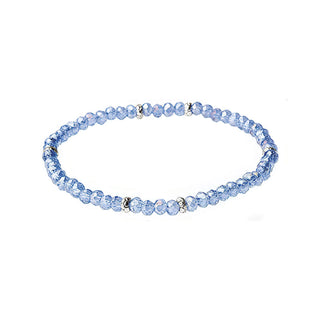 Light blue faceted beaded bracelet with silver spacer accents and elastic closure.
