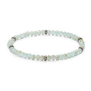 Pale green jade beaded bracelet with silver spacer accents and ornamental details.
