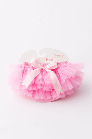 Pink ruffle tutu bloomer with layered tulle skirt and white bow, newborn to 6 months.
