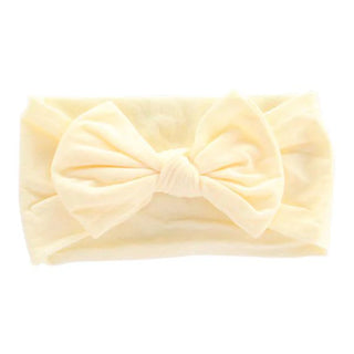 Cream yellow nylon headband with oversized bow and ruched detail.
