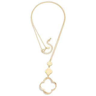 Elegant long gold link necklace with clover pendant, perfect for adding a touch of charm to any outfit.