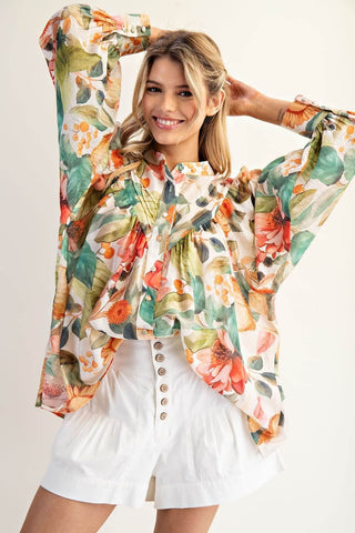 Light yellow button-down blouse with a floral print and short sleeves