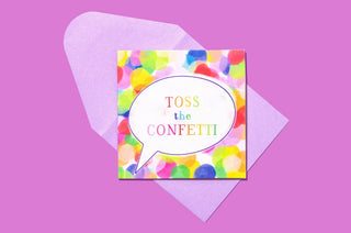 Colorful confetti gift enclosure card with "Toss the Confetti" text on bright multicolored background.
