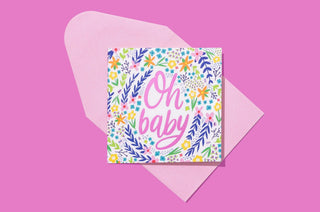 Colorful floral gift card with "Oh baby" text in pink script on bright pink background.

