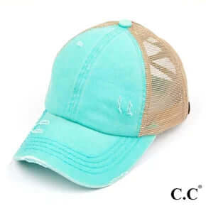 Stylish mint green hat with personalized initials on a sleek hat bar, perfect for a trendy and unique look.