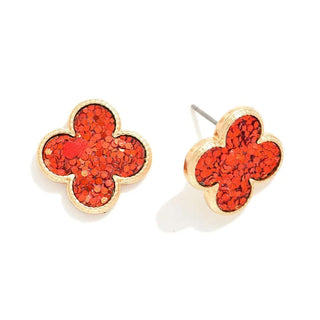 Red glitter clover earrings on white background, perfect for festive occasions or adding sparkle to any outfit.