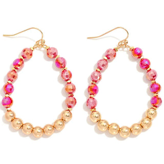 Elegant red faceted and gold bead teardrop earrings with a luxurious, sparkling design, perfect for any occasion.