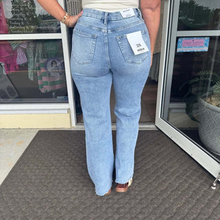 Wide leg denim jeans with a medium wash, featuring distressed knees for a trendy, casual look. Mica W182 style.
