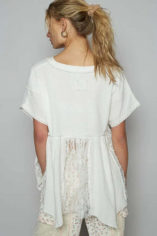 Elegant POL cream lace panel V-neck top on hanger, showcasing intricate lace detailing and soft, flowy fabric for a chic look.