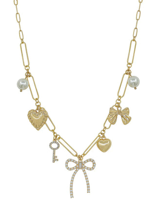 Gold paperclip necklace with pearl bow, heart, and key charms, 16-18 inches, elegant and stylish accessory for any outfit.
