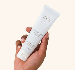 Farmhouse Fresh Coconut Cream Shea Butter Hand Cream in elegant tube with green leaf accents and nourishing formula.