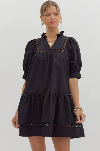 Entro black dress, short sleeve, scallop trim, features convenient pockets for style and functionality. Perfect for any occasion.