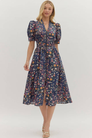 Navy floral print Entro dress with puff sleeves, smock waist, and zip front, perfect for chic, comfortable style.