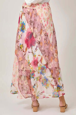Pink floral mix print maxi skirt with flowy fabric, featuring vibrant patterns. Final sale item perfect for summer elegance.