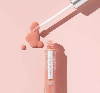 Peach Peony Vitamin Glaze® Lip Gloss by FHF in attractive tube, providing a nourishing, glossy finish for vibrant lips.