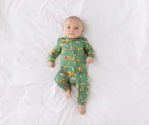 Alt text: "Posh Peanut Crawford Construction Convertible One Piece - Cozy, stylish baby wear with playful construction theme design.
