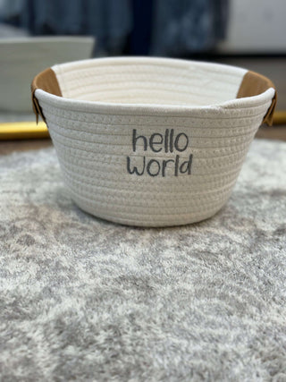 Adorable Hello World Baby Gift Basket with plush teddy, cozy blanket, cute onesie, and soothing essentials for newborns.
