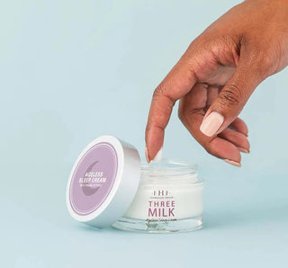 FHF Three Milk Ageless Sleep Cream in sleek jar with calming lavender design, promising youthful skin overnight.