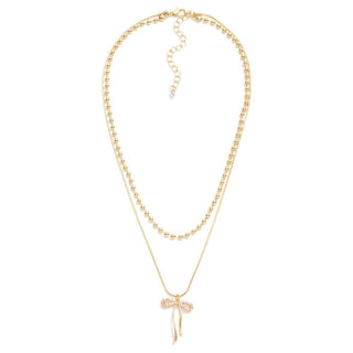Elegant gold beaded chain necklace adorned with a sparkling rhinestone bow pendant, perfect for adding a touch of glamour.